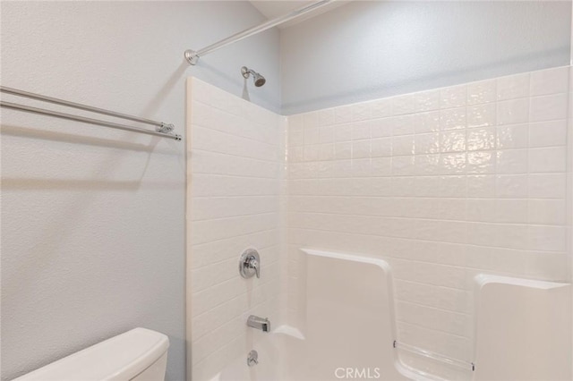 full bathroom with shower / bath combination and toilet