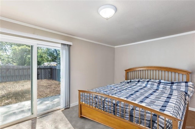 bedroom with access to exterior, crown molding, baseboards, and carpet flooring