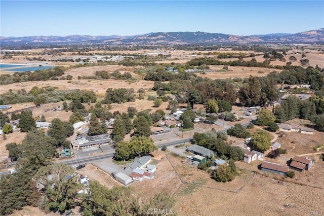 birds eye view of property featuring a mountain view