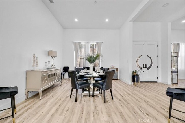 dining area featuring light wood-type flooring