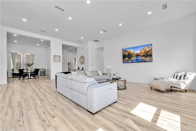 living room with light hardwood / wood-style flooring