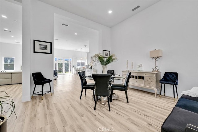 dining space with light hardwood / wood-style flooring