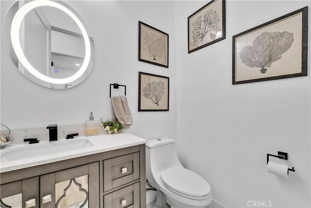 bathroom with vanity and toilet