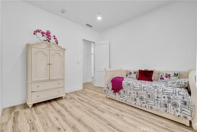 bedroom with light wood-type flooring