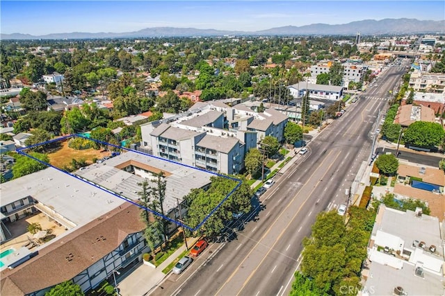 drone / aerial view featuring a mountain view