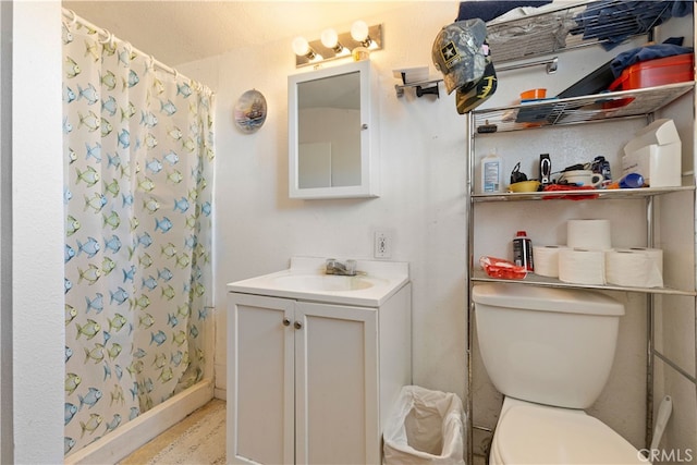 bathroom with vanity, a shower with curtain, and toilet