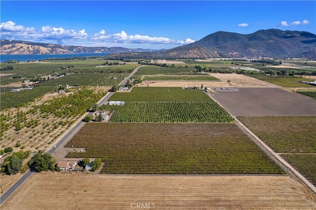 drone / aerial view featuring a rural view and a mountain view