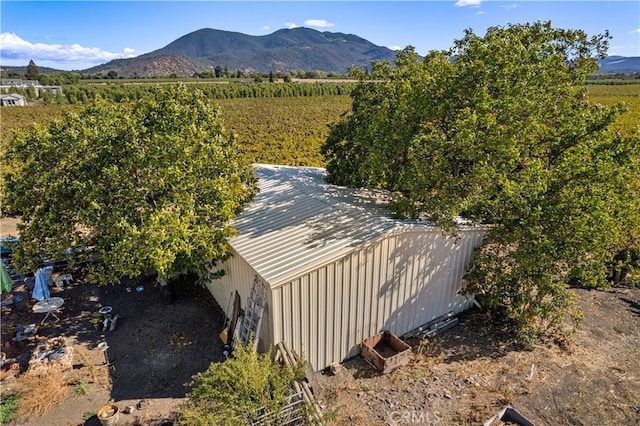 aerial view with a mountain view and a rural view