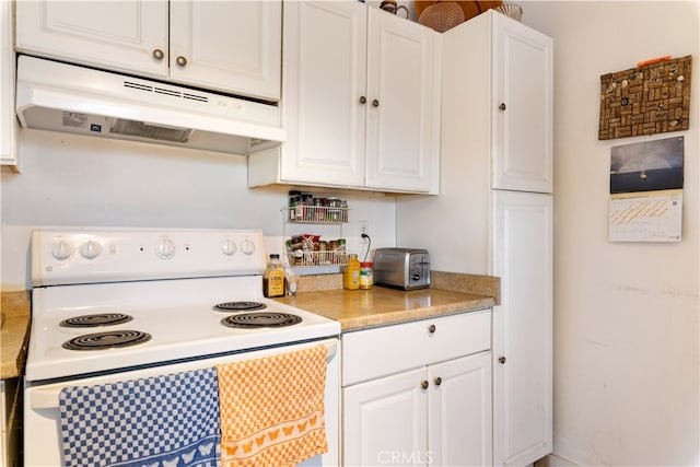 kitchen with white cabinetry and electric range