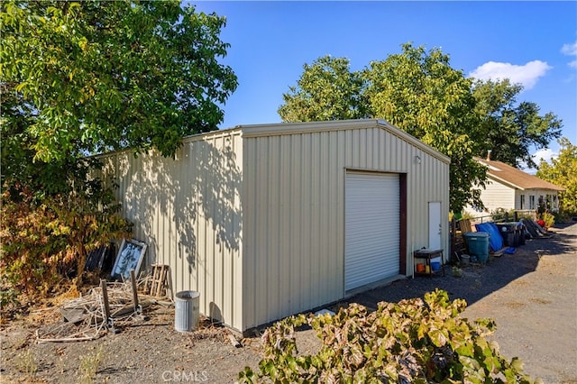 view of outbuilding featuring a garage