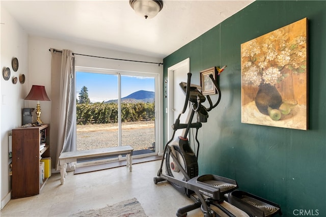 exercise room featuring a mountain view