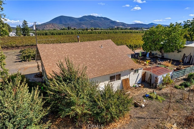 drone / aerial view with a mountain view and a rural view