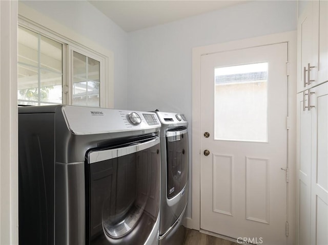 5451 W 117th St, Hawthorne, CA 90304 - washroom with washer and clothes dryer, cabinet space, and wood finished floors