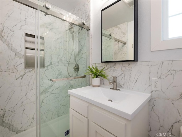 5451 W 117th St, Hawthorne, CA 90304 - full bath featuring vanity, a marble finish shower, and tile walls