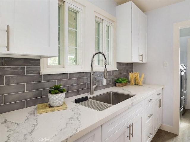5451 W 117th St, Hawthorne, CA 90304 - kitchen with a sink, backsplash, light stone countertops, and white cabinets