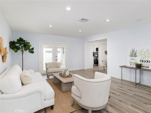 5451 W 117th St, Hawthorne, CA 90304 - living area featuring french doors, light wood-style floors, recessed lighting, and baseboards