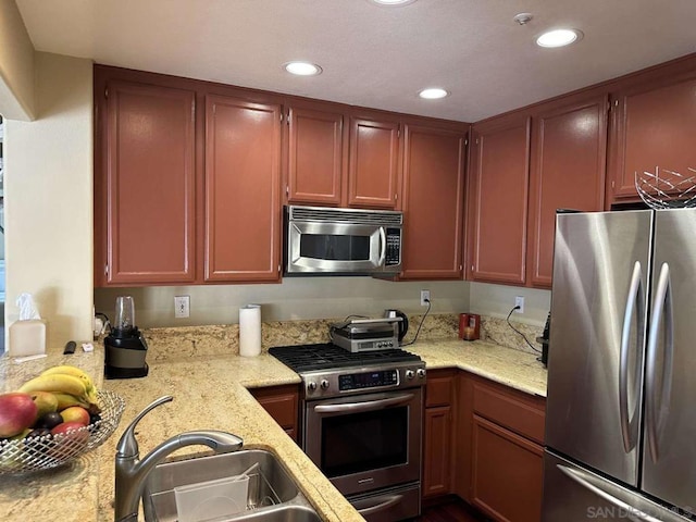 kitchen featuring appliances with stainless steel finishes and sink