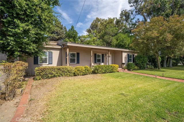 ranch-style house featuring a front lawn