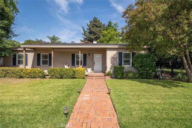 ranch-style home with a front lawn