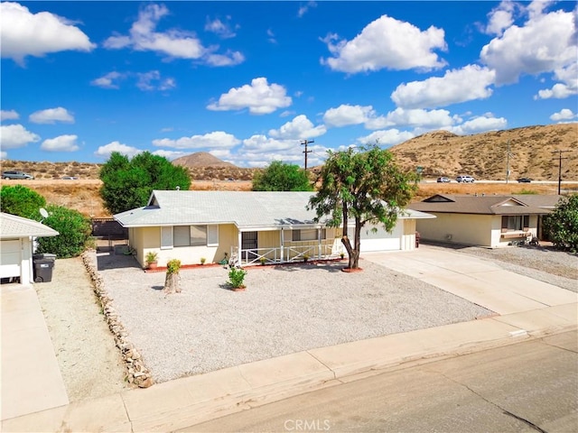 view of front of home featuring a mountain view and a garage