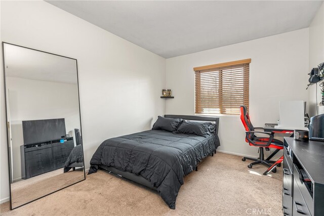 bedroom with light carpet