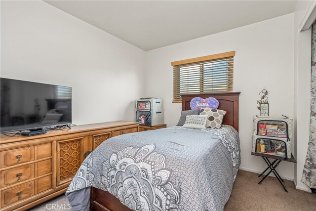 bedroom featuring light colored carpet