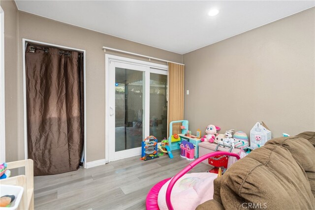 playroom with light wood-type flooring