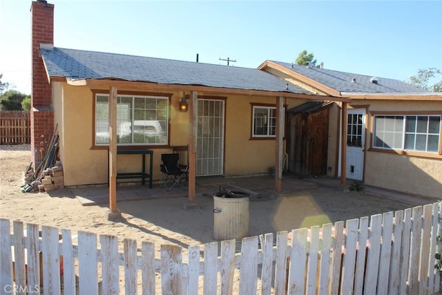 back of house with a patio area