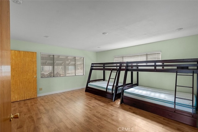 unfurnished bedroom featuring wood-type flooring