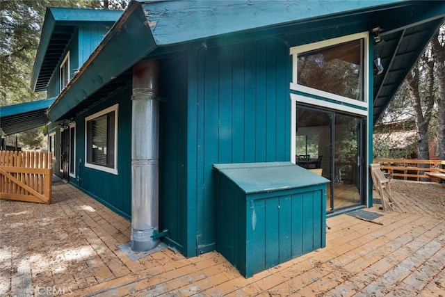 view of side of property featuring a deck