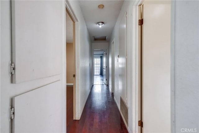 corridor featuring dark hardwood / wood-style flooring