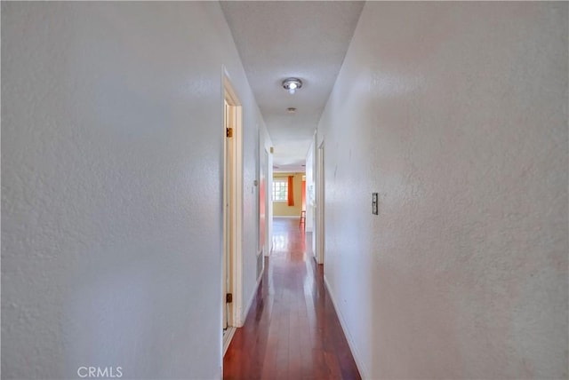 14728 Mansel Ave, Lawndale, CA 90260 - hallway featuring wood-type flooring, baseboards, and a textured wall