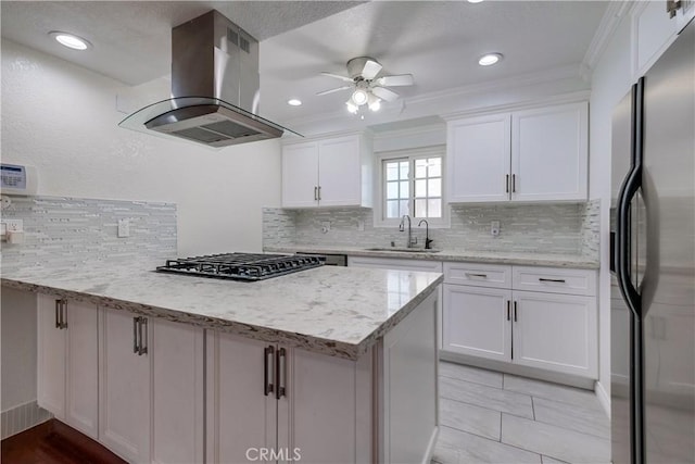 14728 Mansel Ave, Lawndale, CA 90260 - kitchen featuring fridge with ice dispenser, island range hood, a sink, a peninsula, and gas cooktop