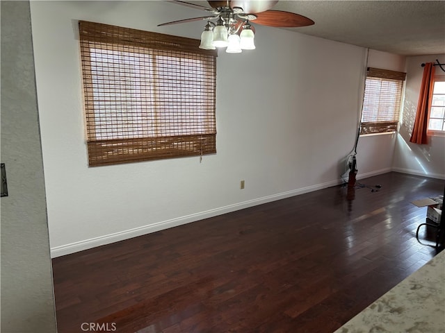 14728 Mansel Ave, Lawndale, CA 90260 - unfurnished room with a ceiling fan, dark wood-style floors, a textured ceiling, and baseboards