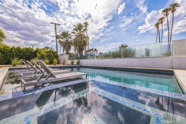 view of pool featuring a jacuzzi