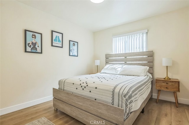 bedroom featuring light wood-type flooring