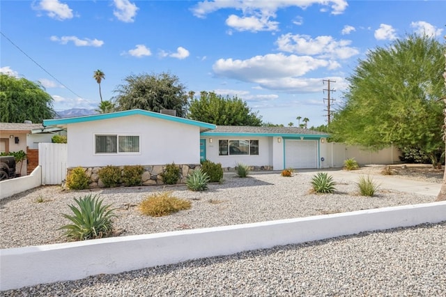 ranch-style home featuring a garage