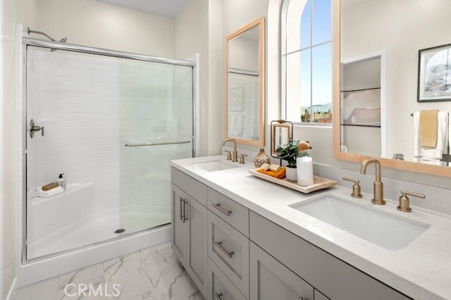 bathroom with vanity and an enclosed shower