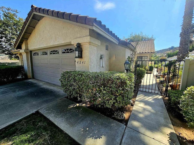 view of property exterior featuring a garage