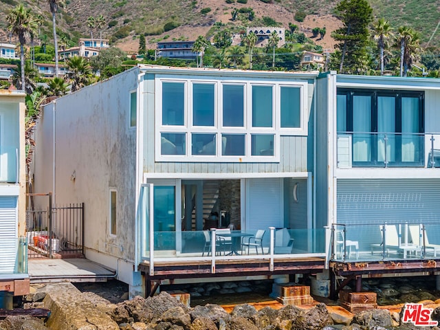 rear view of property with a mountain view