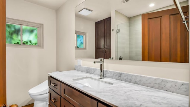 bathroom with vanity and toilet