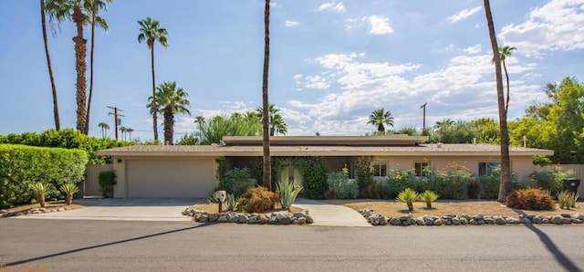 ranch-style house featuring a garage