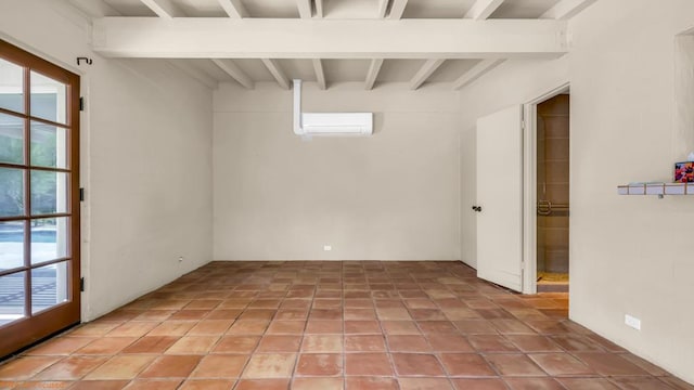 basement with a wall mounted AC and light tile patterned floors