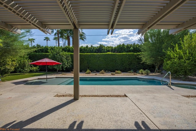 view of pool with a pergola and a patio