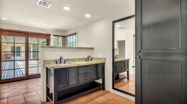 bathroom featuring tile patterned floors and vanity