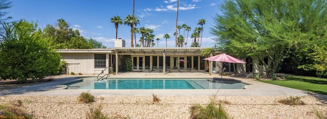 view of swimming pool featuring a patio