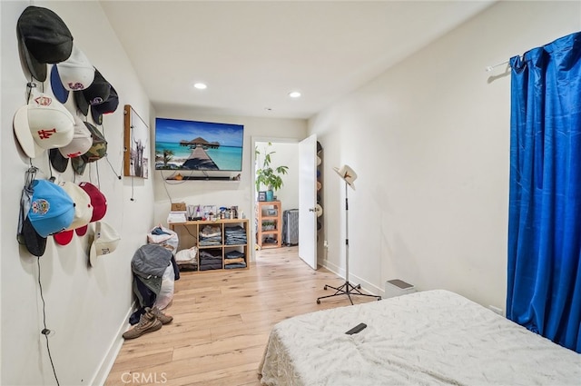 bedroom with hardwood / wood-style floors