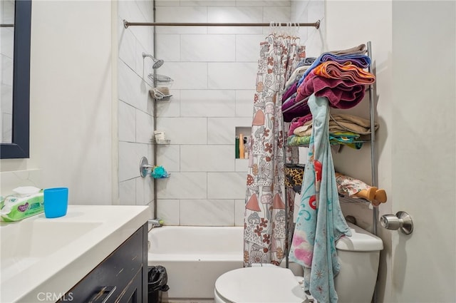 full bathroom with shower / bath combo, vanity, and toilet