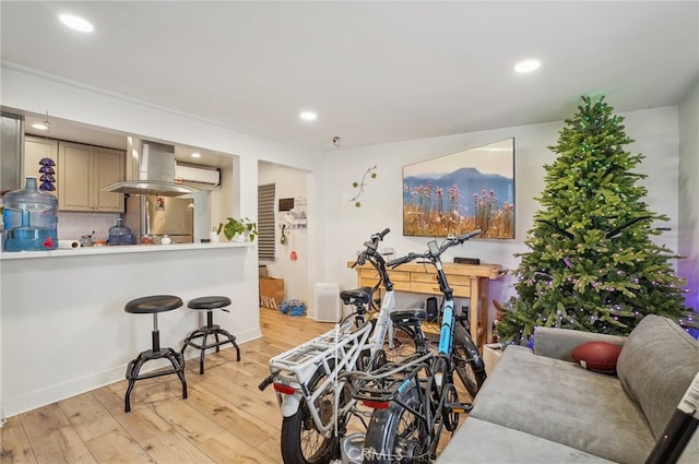 workout room with light hardwood / wood-style floors