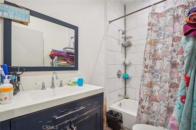 full bathroom with shower / bath combo, vanity, and toilet